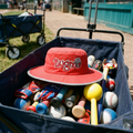 Red boonie hat on top of the team gear wagon