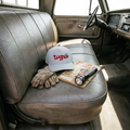 Lugnuts Zapped Blackhawk Cap resting on an old truck seat