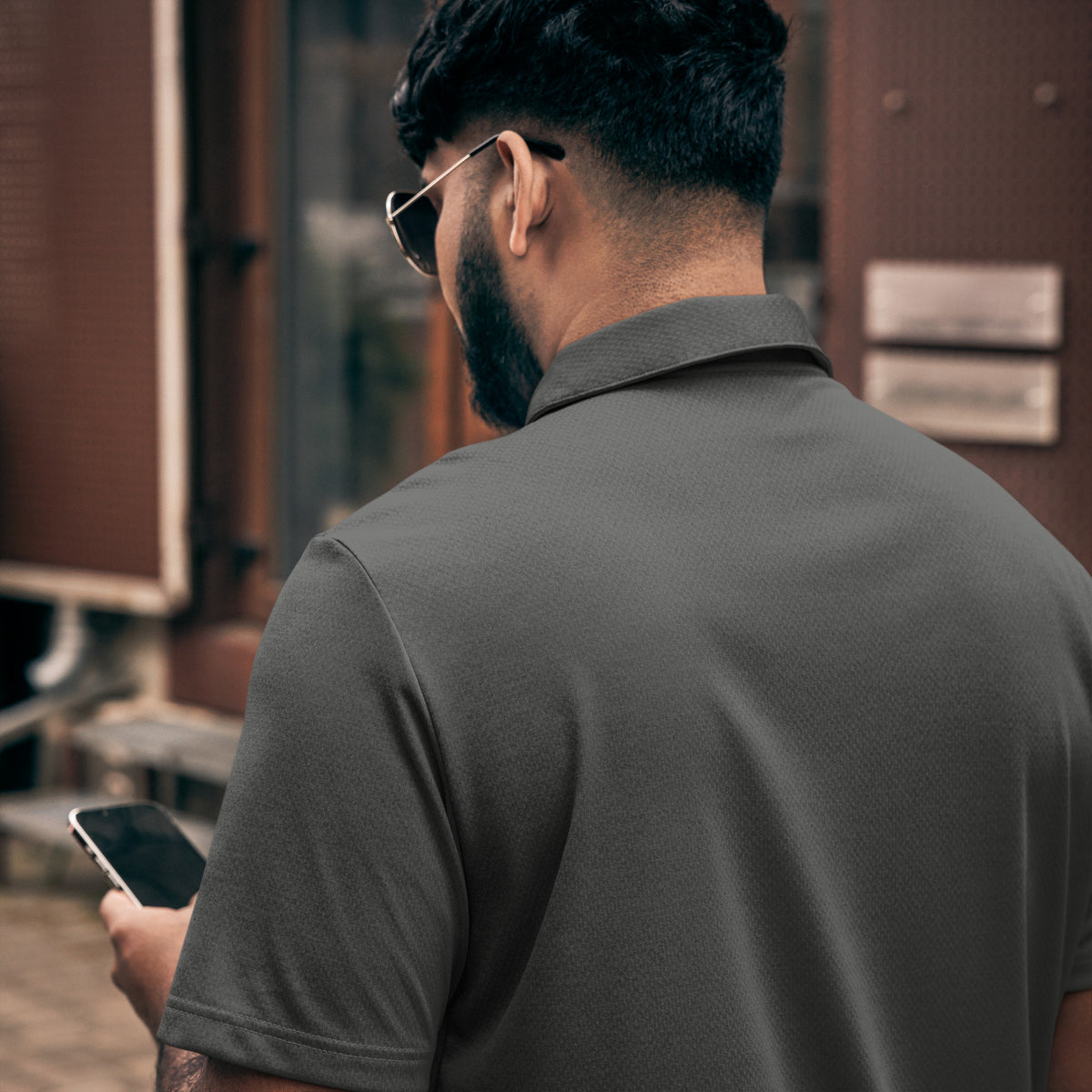 Adidas space-dyed polo shirt in Black Melange, back view