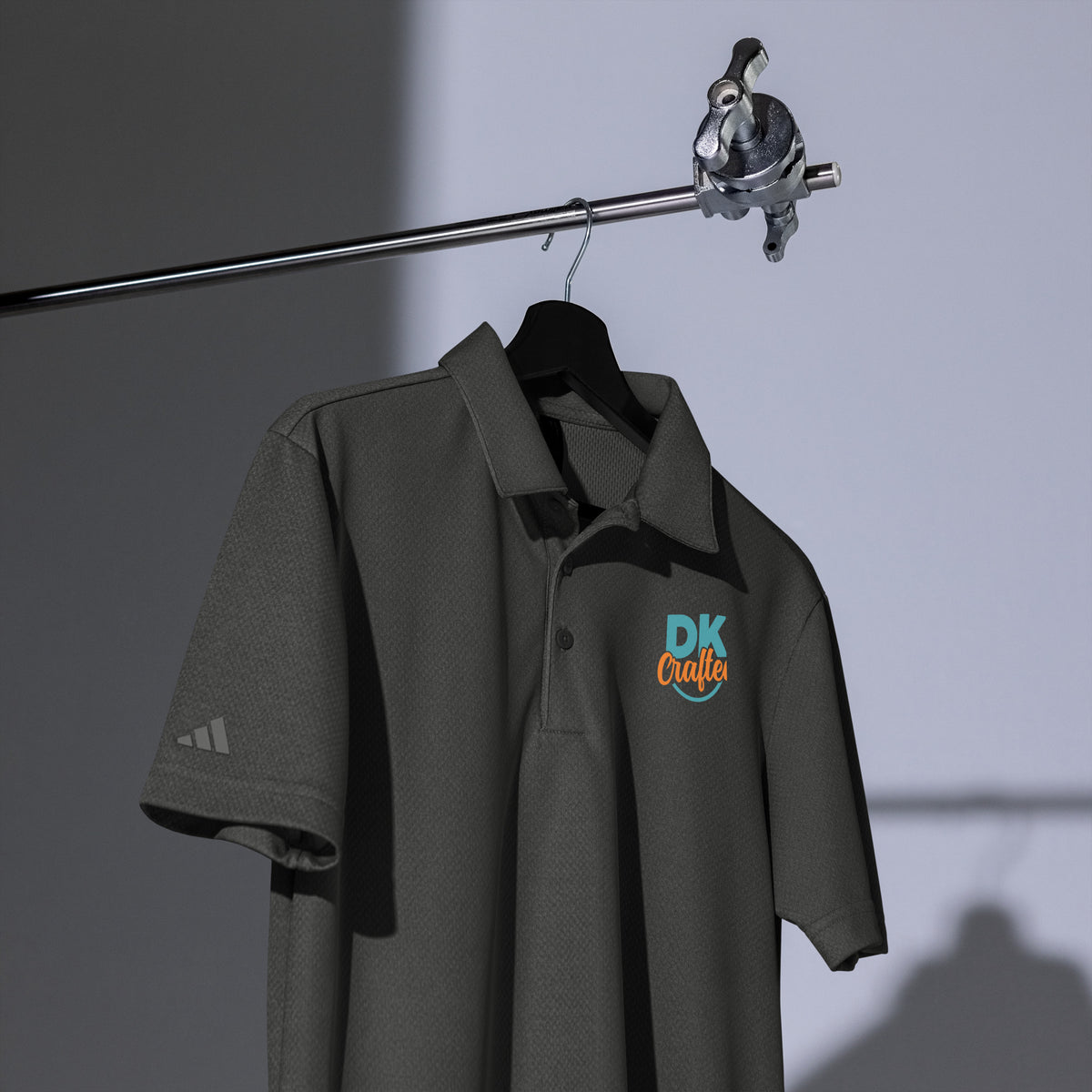 Adidas space-dyed polo shirt in Black Melange, front view