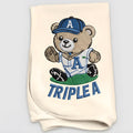 Embroidered teddy bear design detail on baby blanket