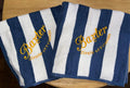 Custom beach towel personalization detail, name embroidered on stripe