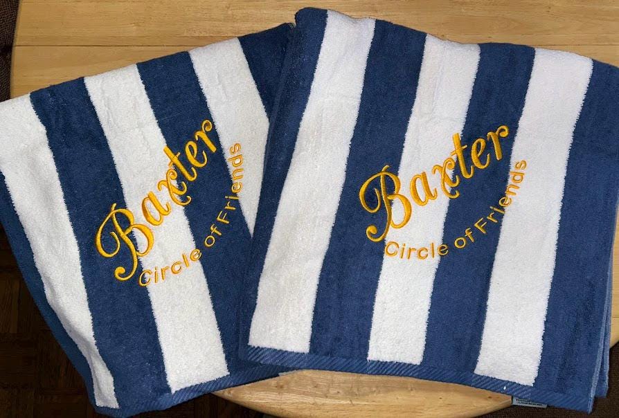 Custom beach towel personalization detail, name embroidered on stripe